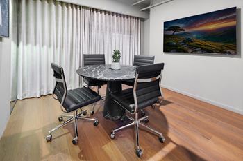 Conference room with marble table and leather chairs
